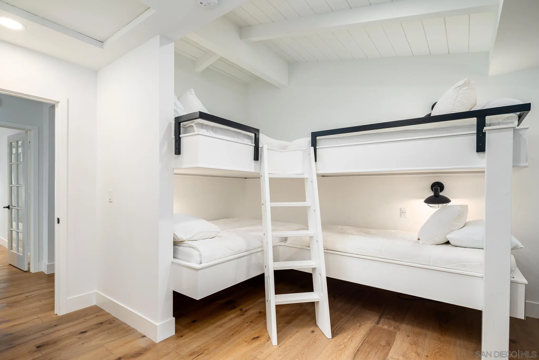 16610 Los Morros Rancho Santa Fe, CA 92067 - Photo 16 of 50 a white bedroom with a bed and a window