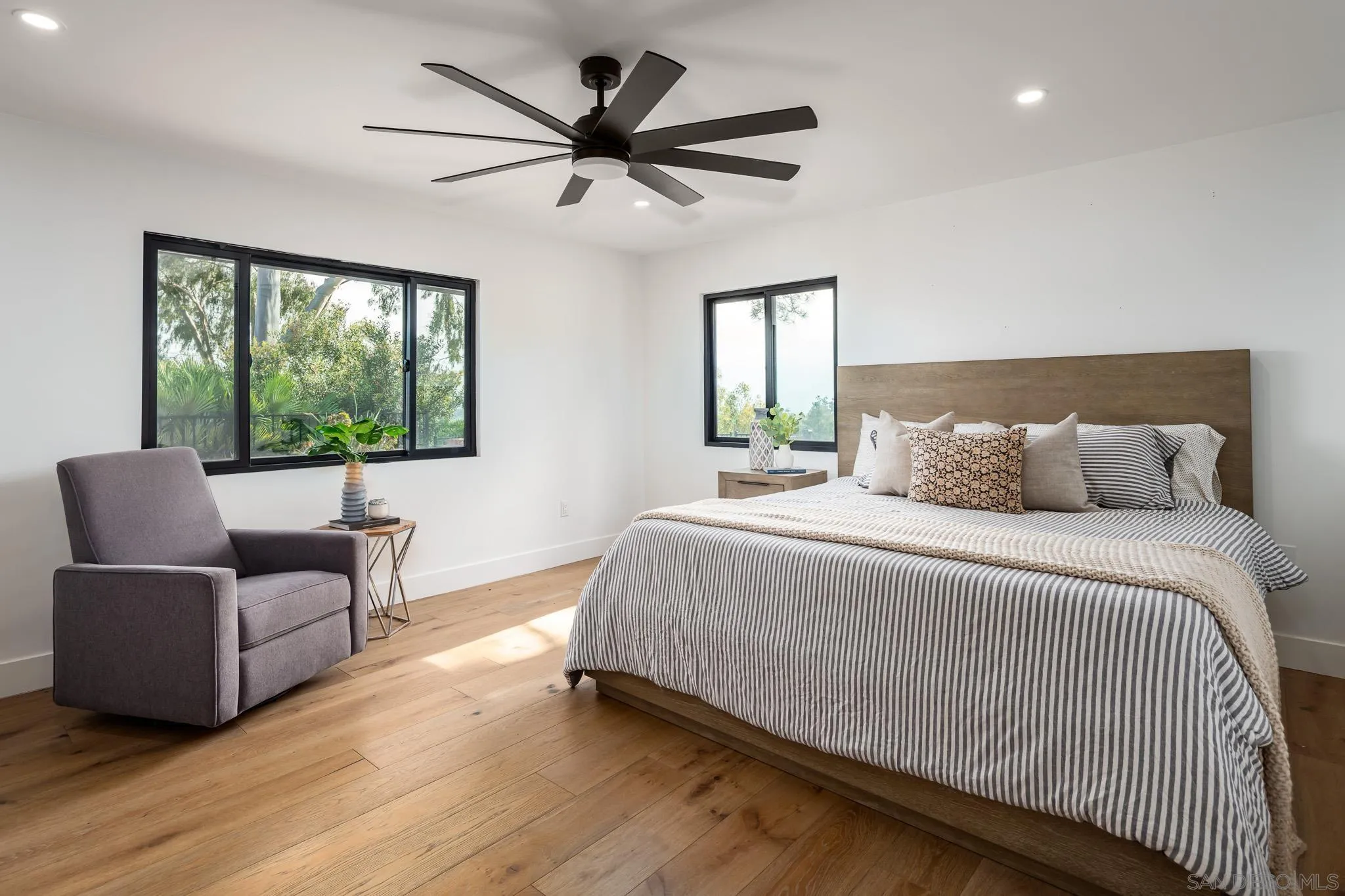 16610 Los Morros Rancho Santa Fe, CA 92067 - Photo 18 of 50 a bedroom with a large bed and a large window
