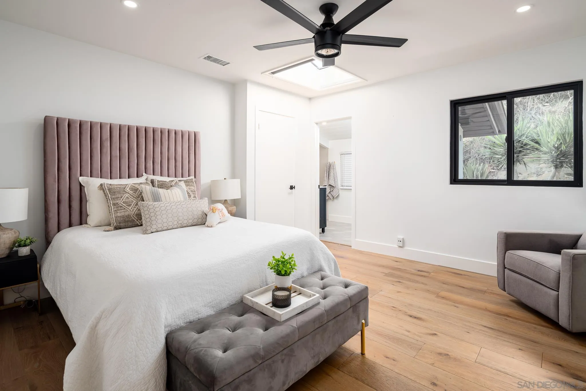 16610 Los Morros Rancho Santa Fe, CA 92067 - Photo 19 of 50 a bedroom with a bed couches and window