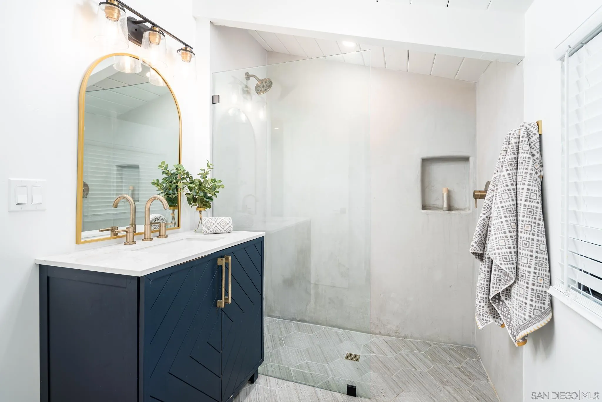 16610 Los Morros Rancho Santa Fe, CA 92067 - Photo 20 of 50 a bathroom with a sink vanity and shower