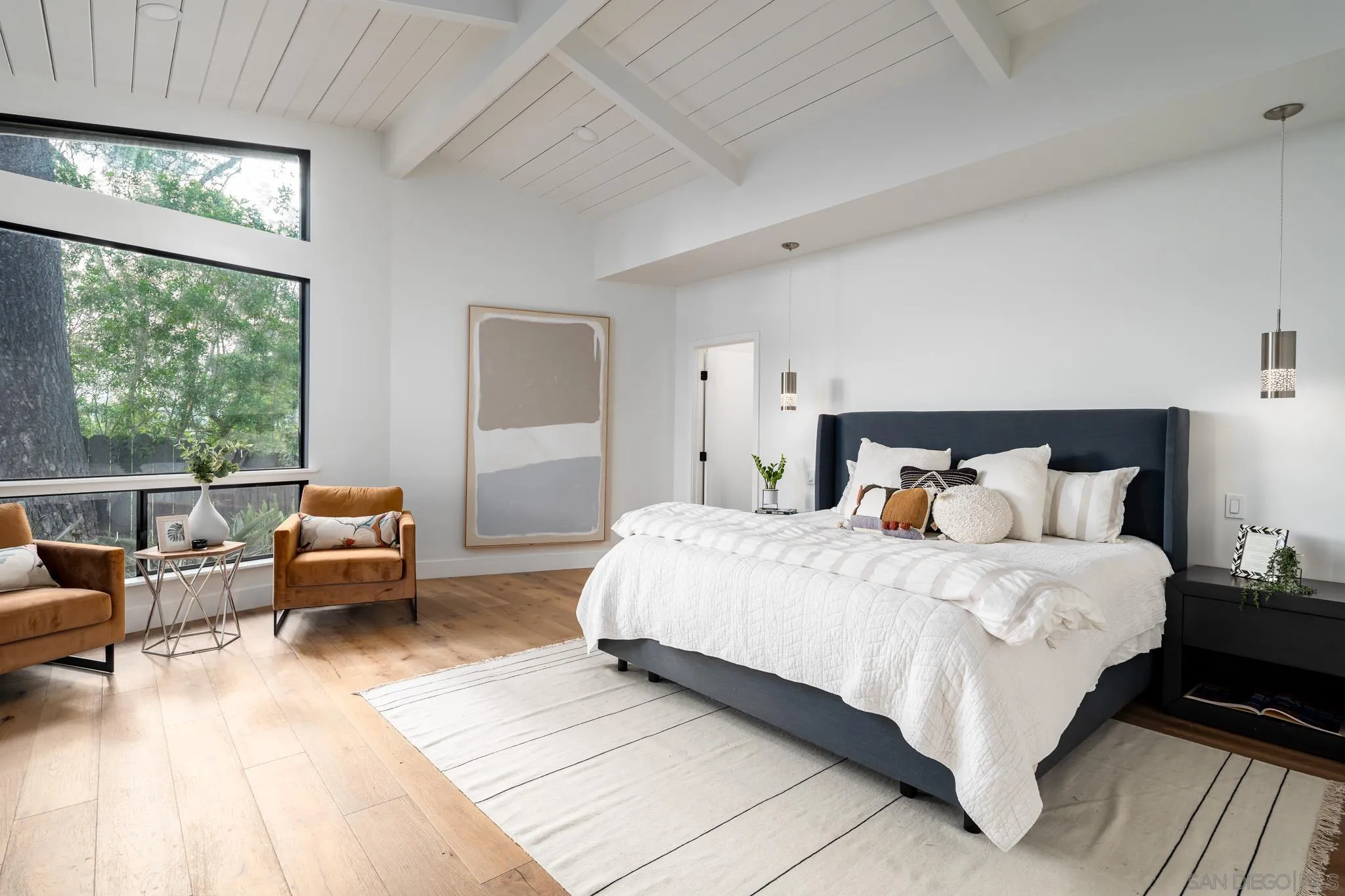 16610 Los Morros Rancho Santa Fe, CA 92067 - Photo 21 of 50 a bedroom with a bed and a large window