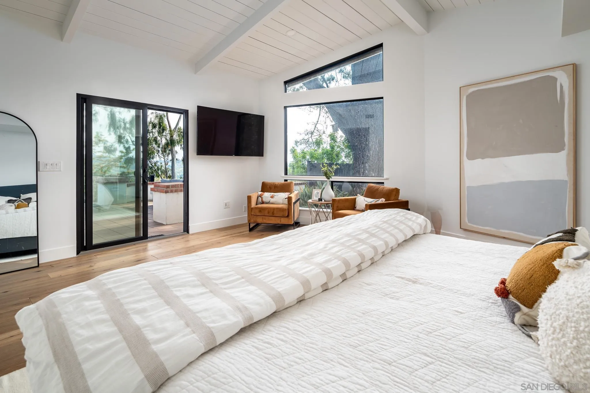 16610 Los Morros Rancho Santa Fe, CA 92067 - Photo 22 of 50 a bedroom with a bed and large windows