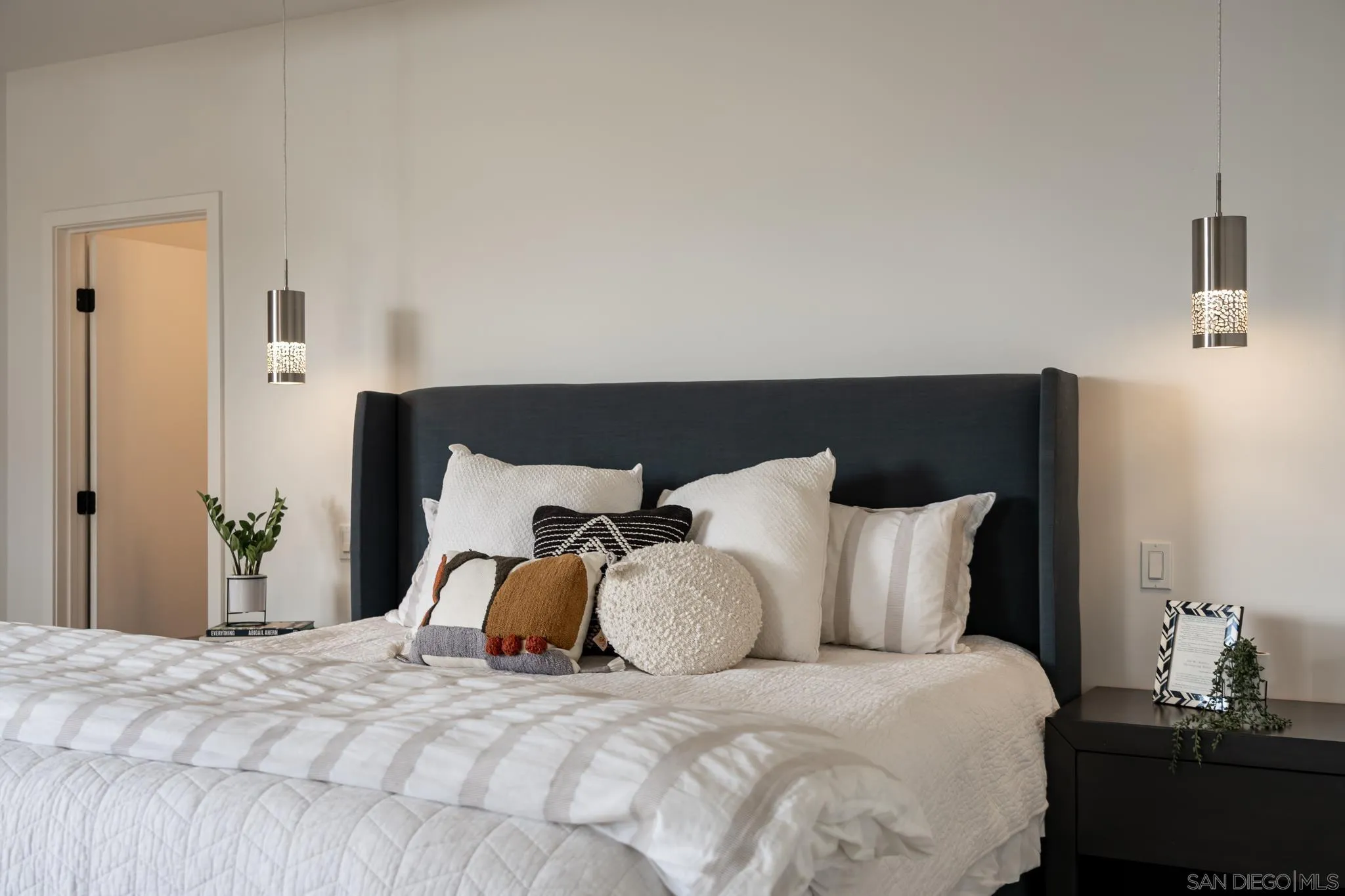 16610 Los Morros Rancho Santa Fe, CA 92067 - Photo 24 of 50 a bedroom with a bed and wooden floor