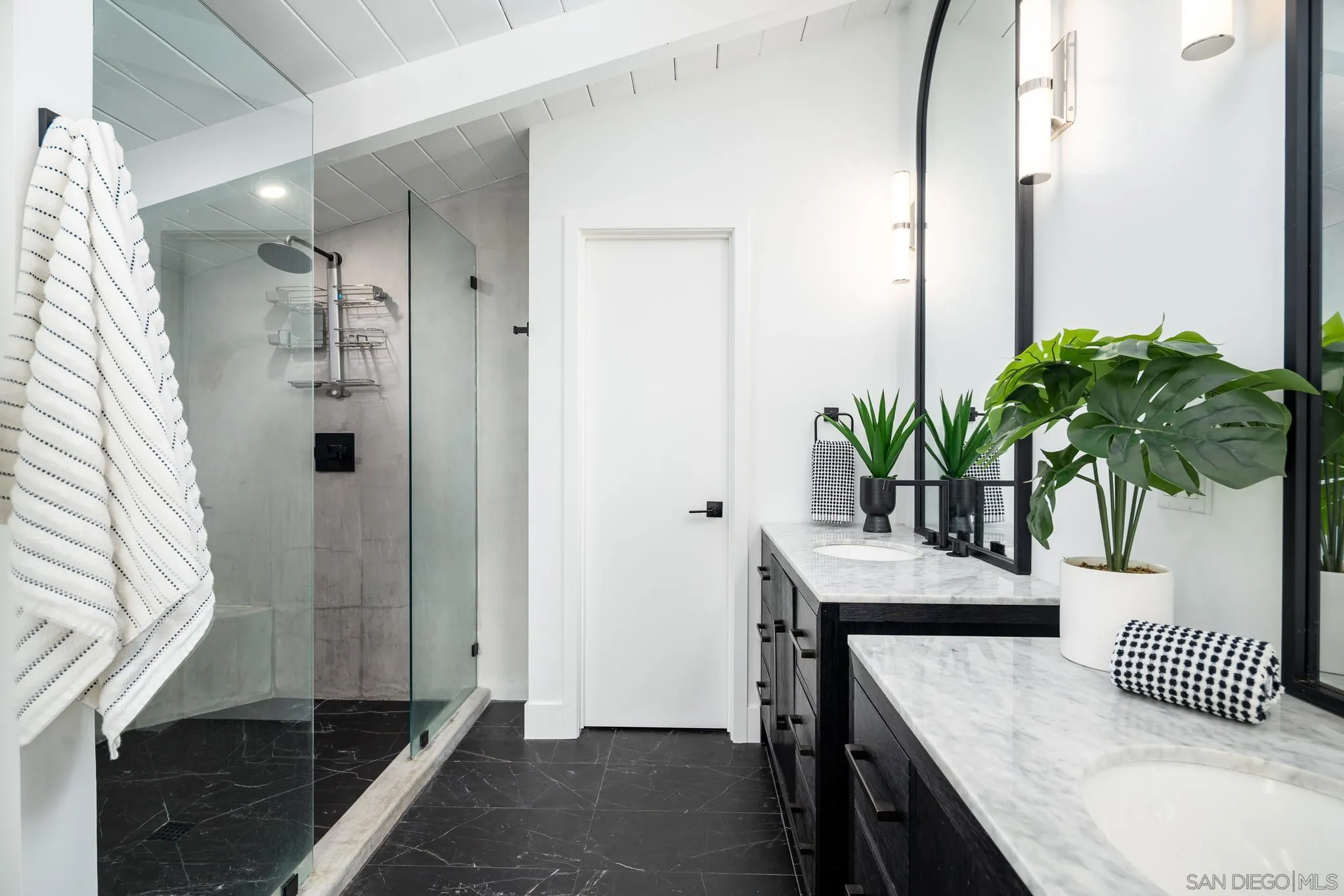 16610 Los Morros Rancho Santa Fe, CA 92067 - Photo 25 of 50 a bathroom with a sink a mirror and a potted plant