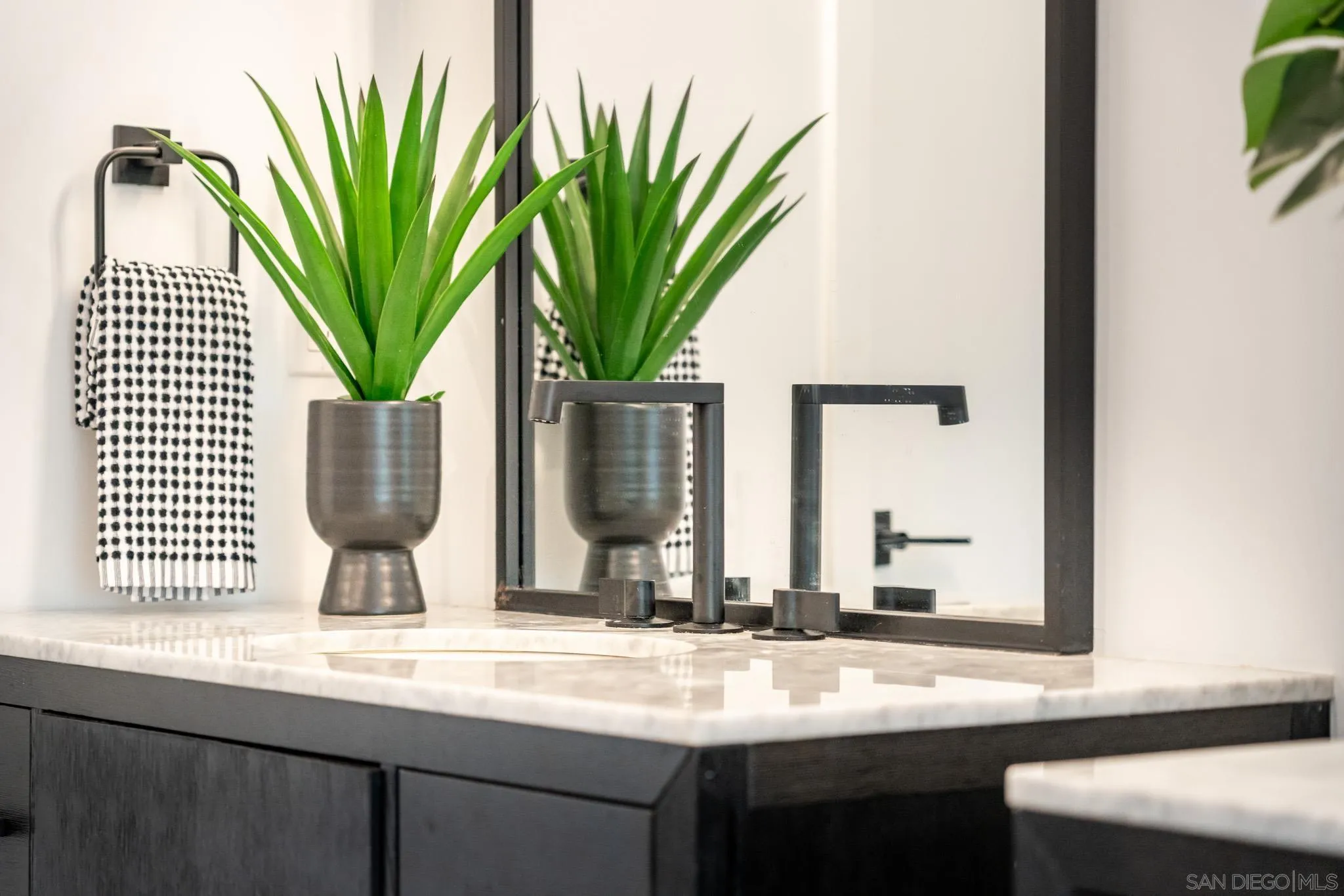 16610 Los Morros Rancho Santa Fe, CA 92067 - Photo 27 of 50 a bathroom with a sink and a mirror