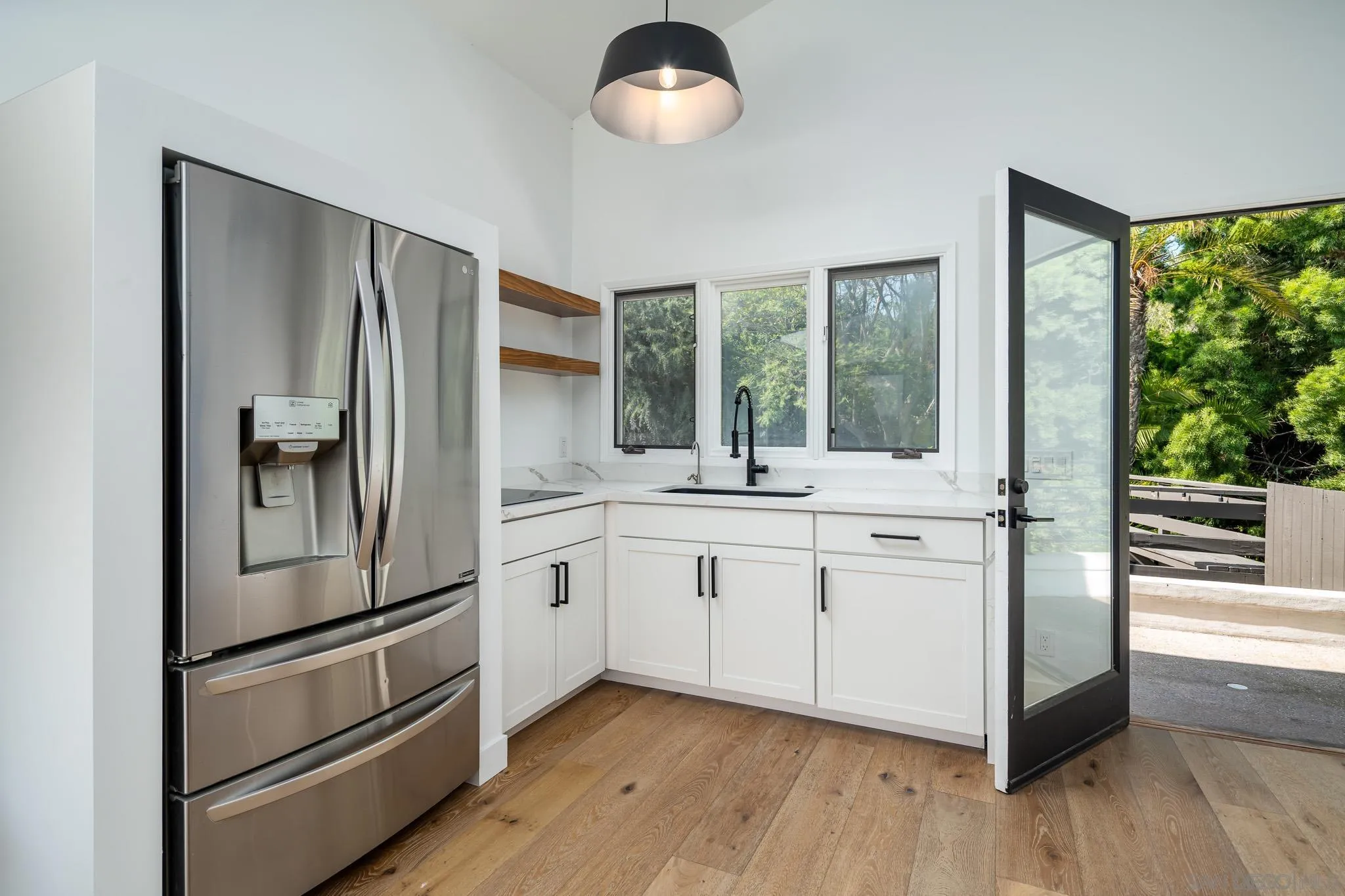 16610 Los Morros Rancho Santa Fe, CA 92067 - Photo 31 of 50 a kitchen with stainless steel appliances granite countertop a refrigerator and a sink