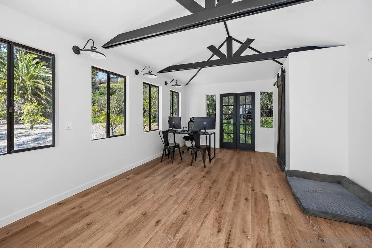 16610 Los Morros Rancho Santa Fe, CA 92067 - Photo 33 of 50 a view of a dining room with furniture window and wooden floor