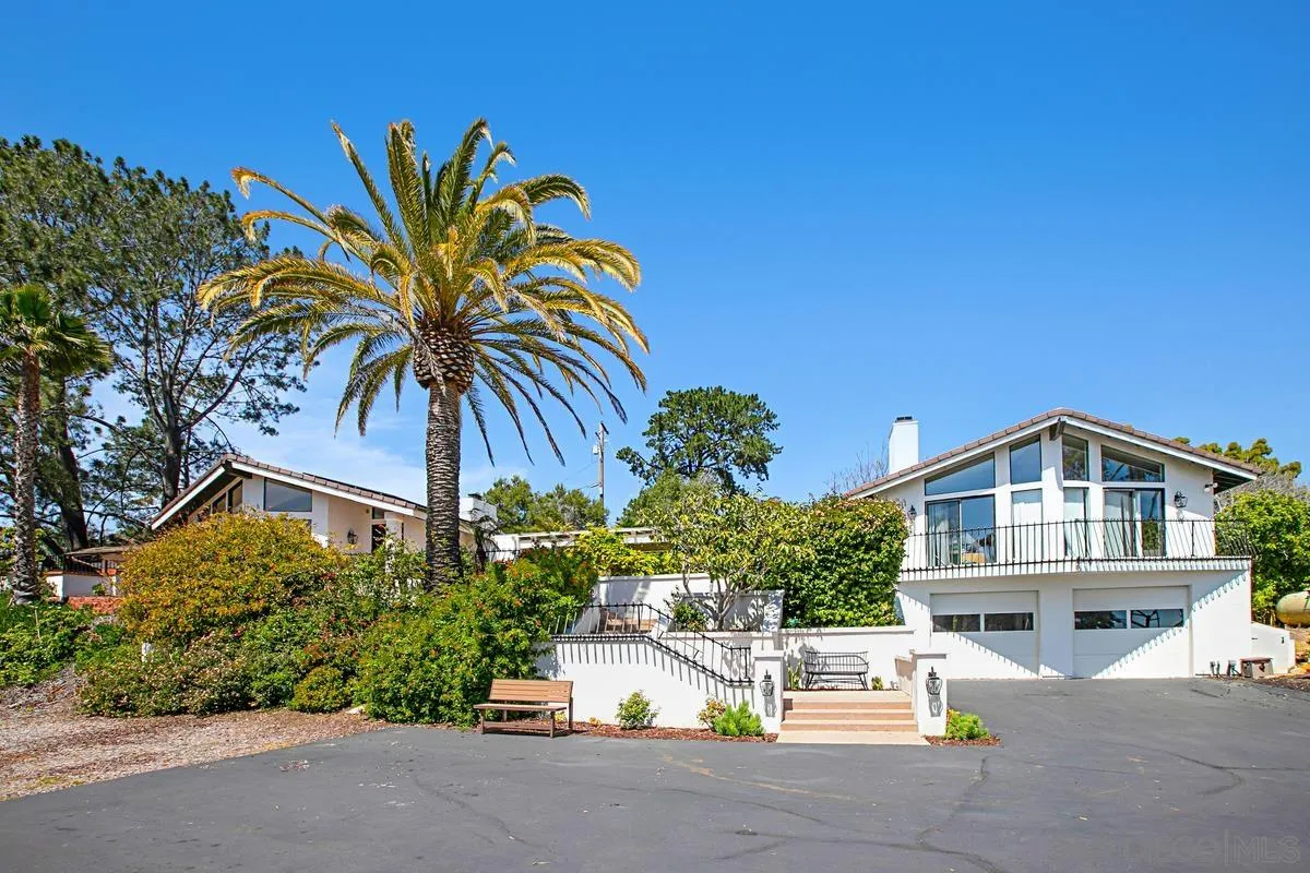 16610 Los Morros Rancho Santa Fe, CA 92067 - Photo 35 of 50 a front view of a house with a garden