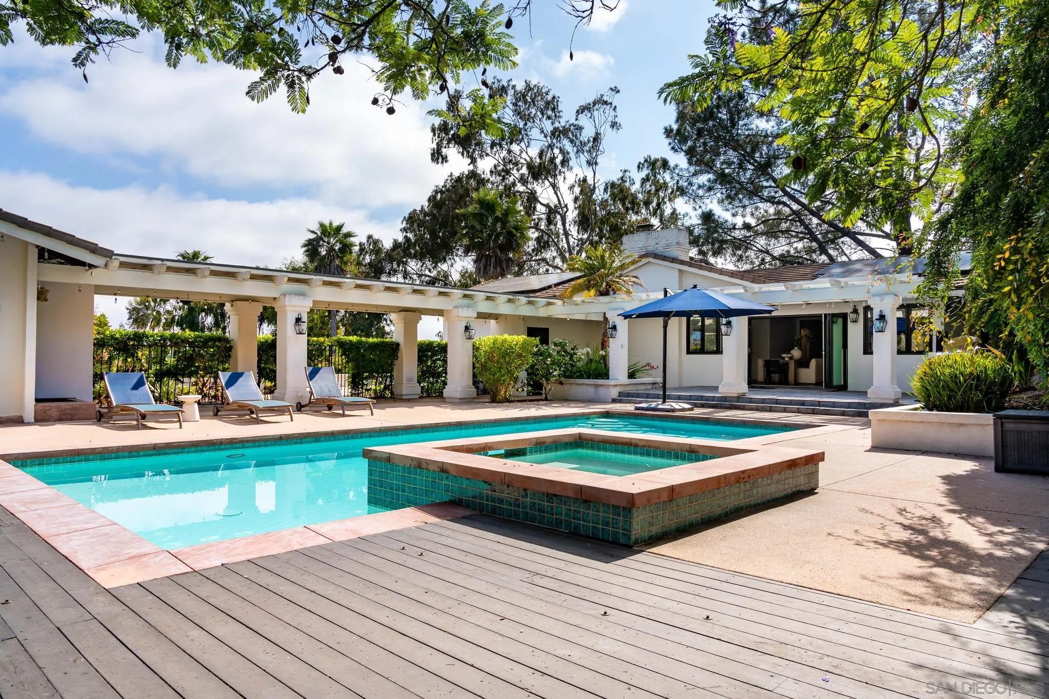 16610 Los Morros Rancho Santa Fe, CA 92067 - Photo 37 of 50 a view of house with swimming pool and outdoor seating