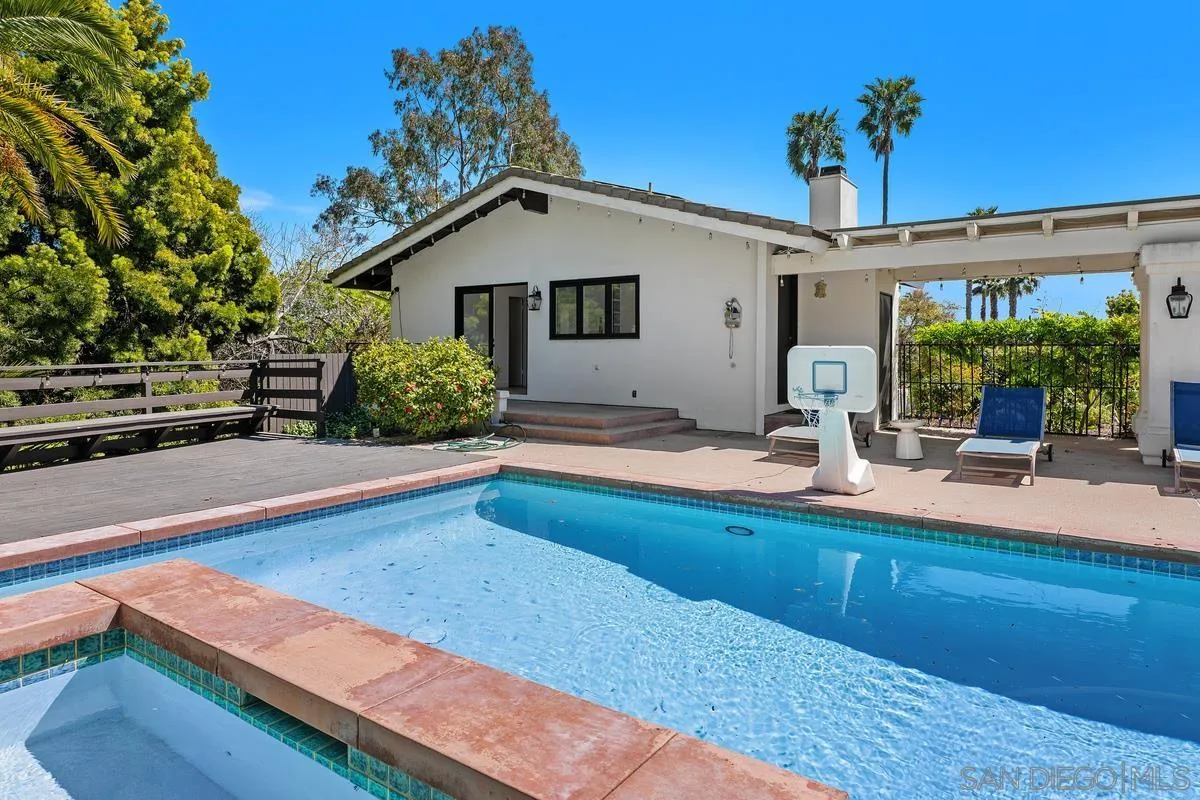 16610 Los Morros Rancho Santa Fe, CA 92067 - Photo 39 of 50 a view of a house with a swimming pool