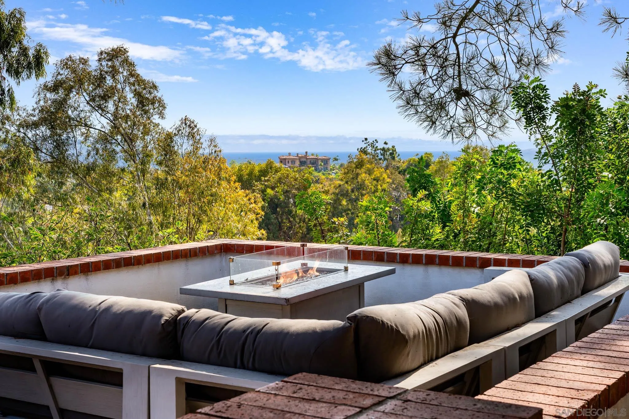 16610 Los Morros Rancho Santa Fe, CA 92067 - Photo 41 of 50 a view of swimming pool with seating area and trees in the background