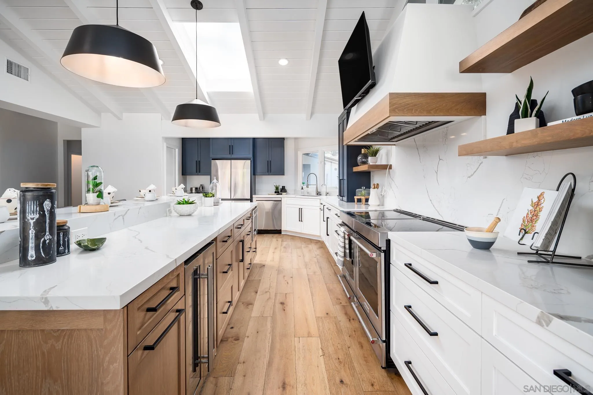 16610 Los Morros Rancho Santa Fe, CA 92067 - Photo 8 of 50 a kitchen with stainless steel appliances granite countertop a sink a stove and a wooden floors