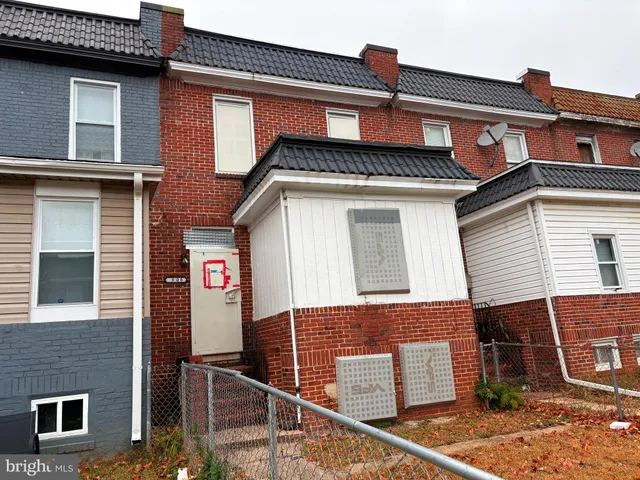 a front view of a house with parking