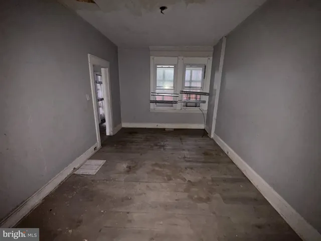 a view of hallway with a sink and a window