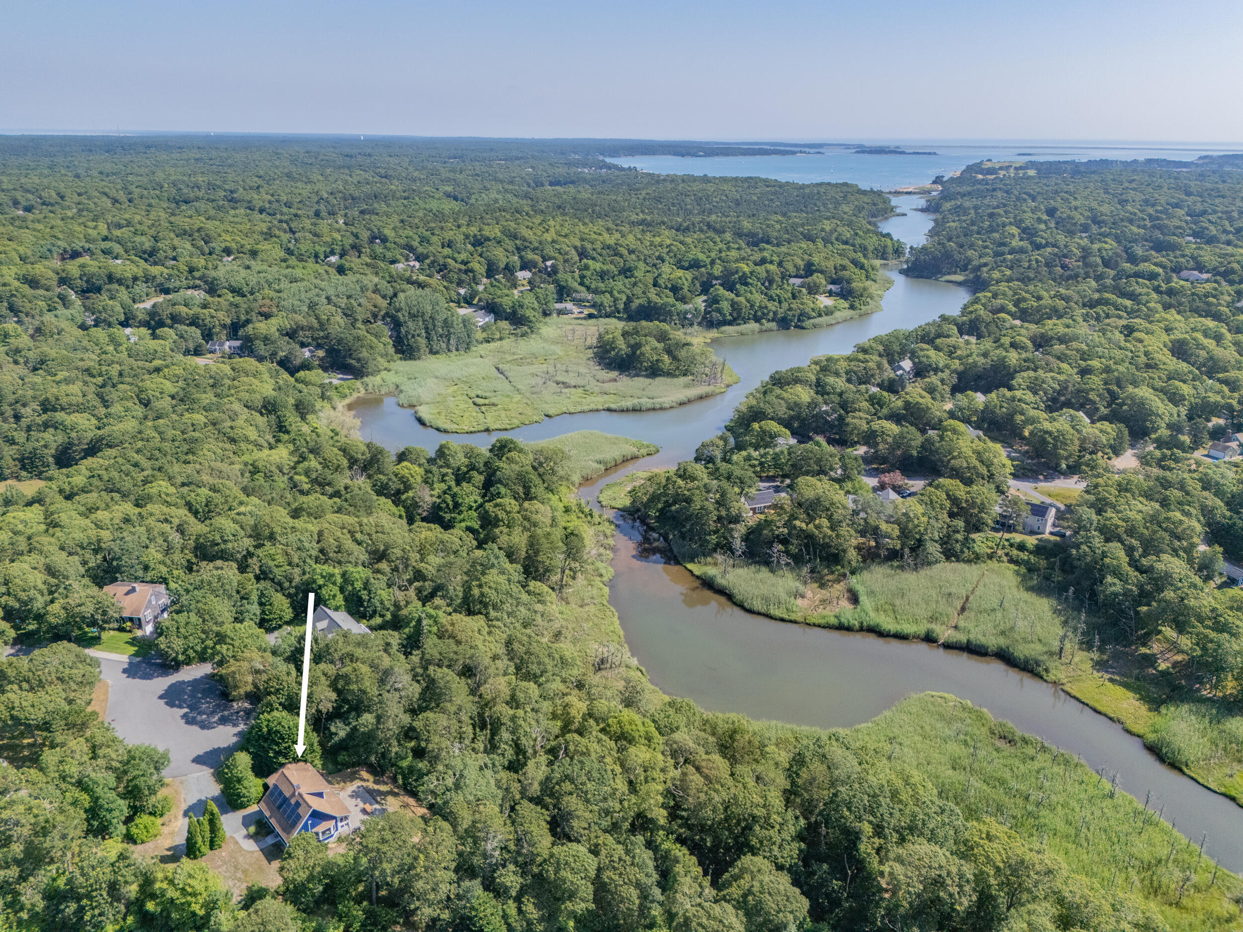 24 Chickadee Circle Chatham, MA 02633 - Photo 3 of 44 an aerial view of a house with a yard and lake