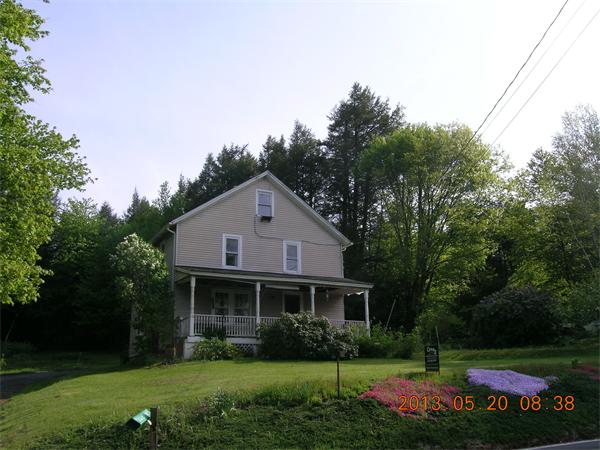 122 Pond Brook Road Huntington, MA 01050 - Photo 1 of 19 a front view of house with yard and green space
