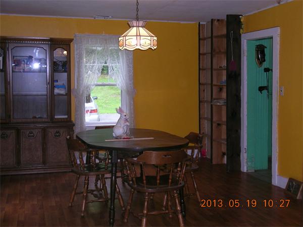 122 Pond Brook Road Huntington, MA 01050 - Photo 12 of 19 a view of a dining room with furniture and chandelier