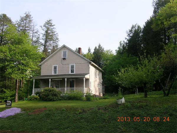 122 Pond Brook Road Huntington, MA 01050 - Photo 2 of 19 a front view of a house with a yard