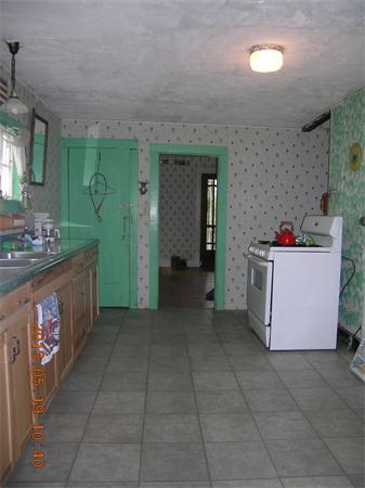 122 Pond Brook Road Huntington, MA 01050 - Photo 7 of 19 a kitchen with a stove and cabinets