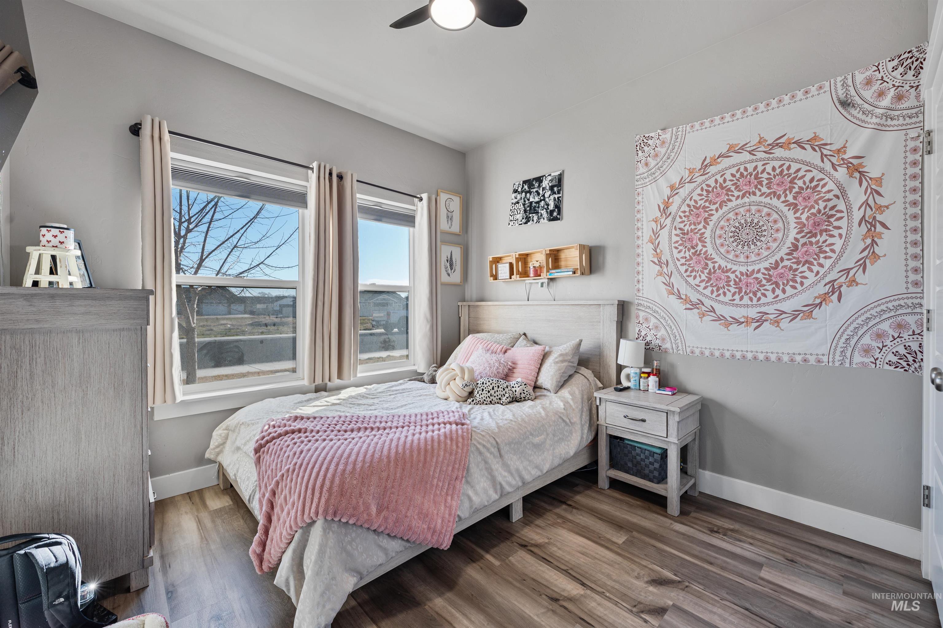 1005 Kenbrook Loop Twin Falls, ID 83301 - Photo 15 of 47 Bedroom featuring wood finished floors and ceiling fan