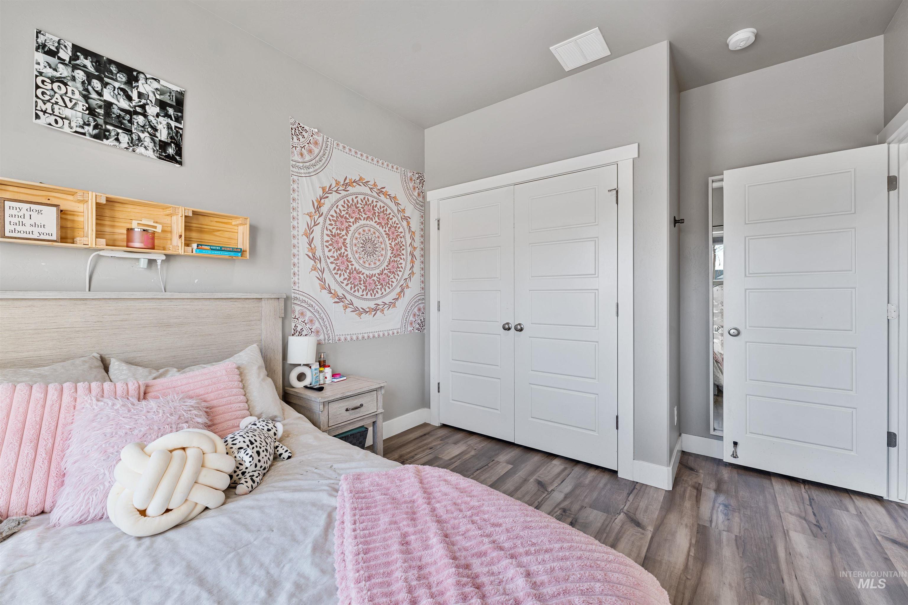 1005 Kenbrook Loop Twin Falls, ID 83301 - Photo 16 of 47 Bedroom featuring a closet and dark wood-style floors