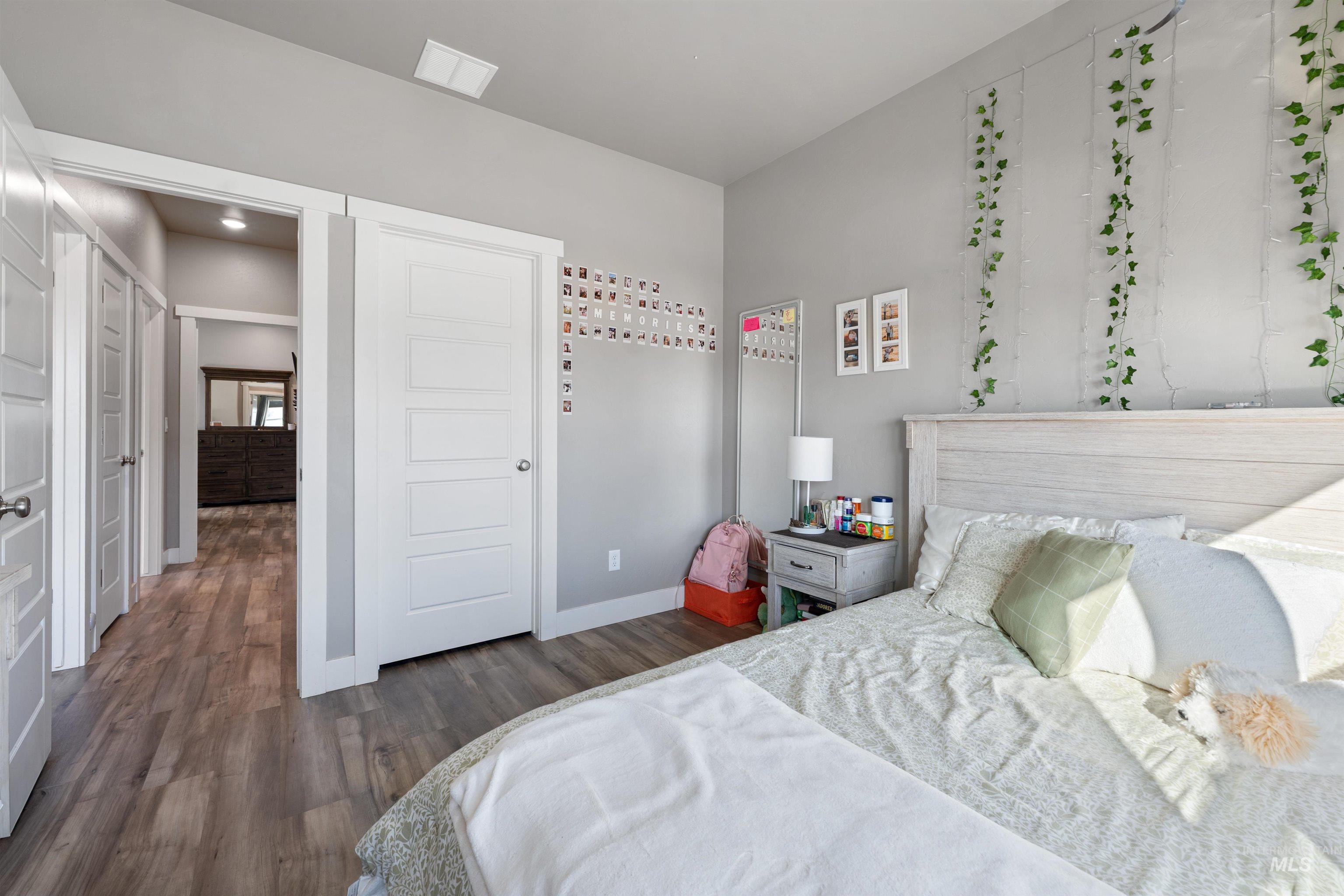 1005 Kenbrook Loop Twin Falls, ID 83301 - Photo 24 of 47 Bedroom with dark wood-style flooring and baseboards