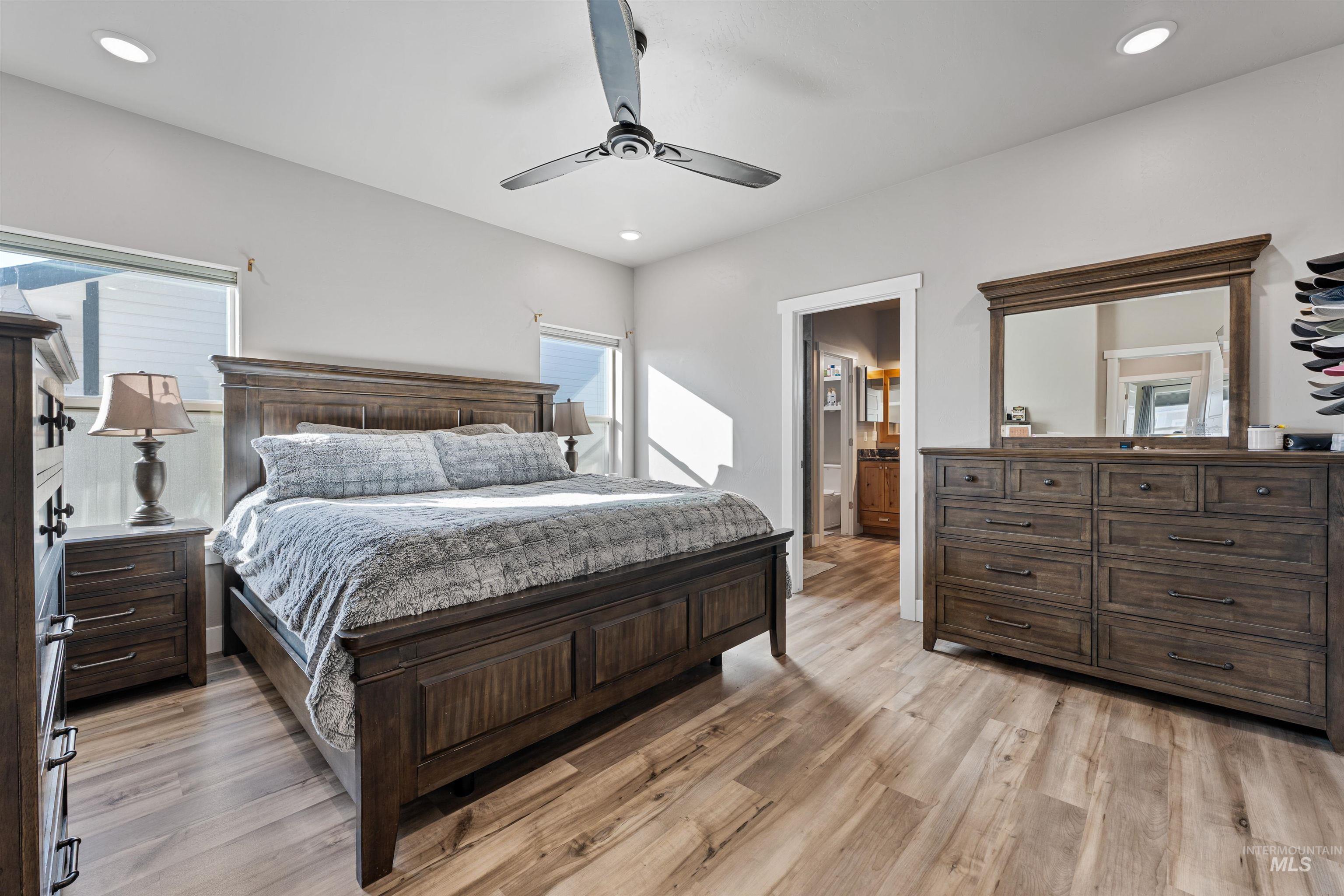 1005 Kenbrook Loop Twin Falls, ID 83301 - Photo 25 of 47 Bedroom featuring light wood-style floors, a ceiling fan, ensuite bath, and recessed lighting