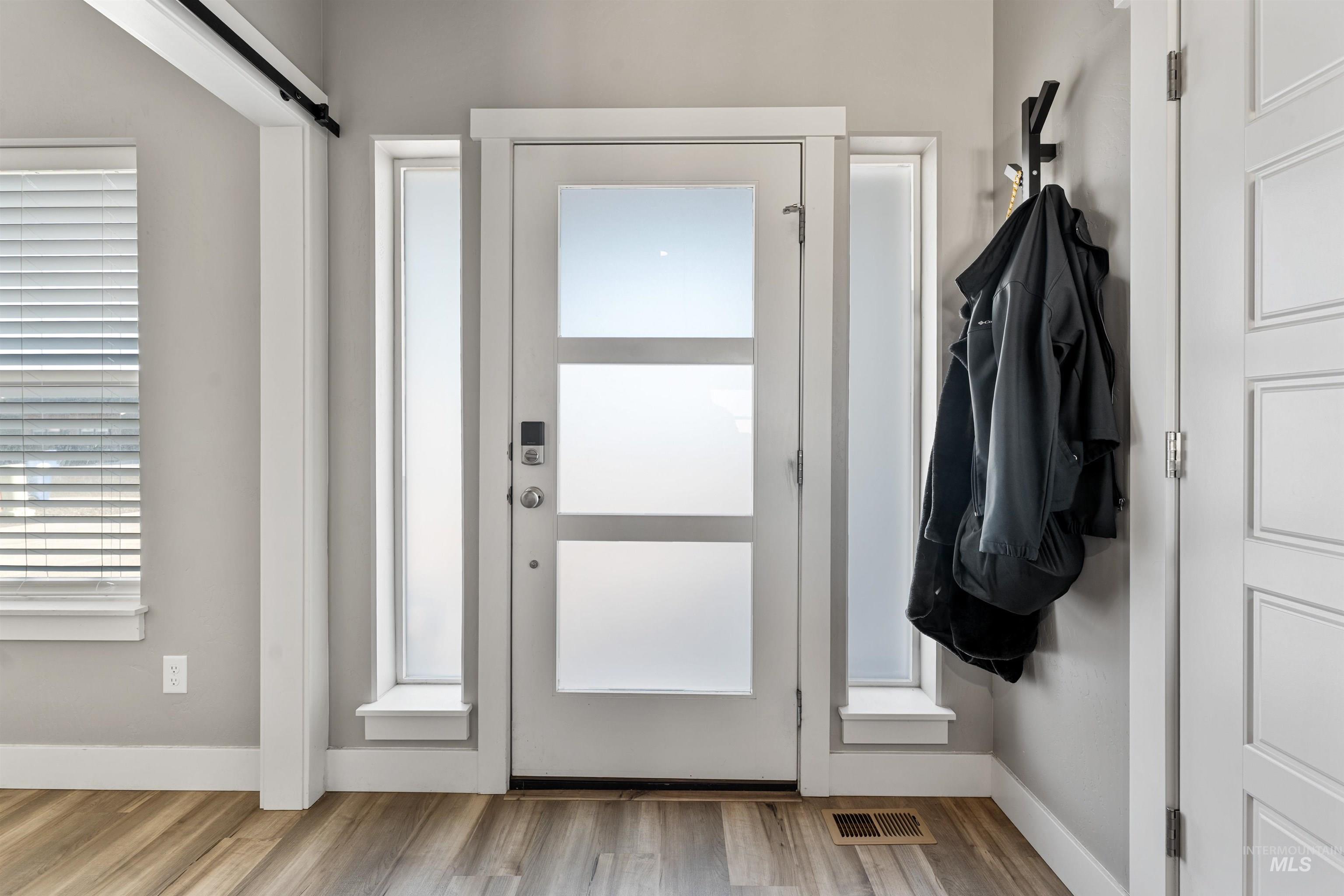 1005 Kenbrook Loop Twin Falls, ID 83301 - Photo 3 of 47 Entryway featuring light wood finished floors and a barn door