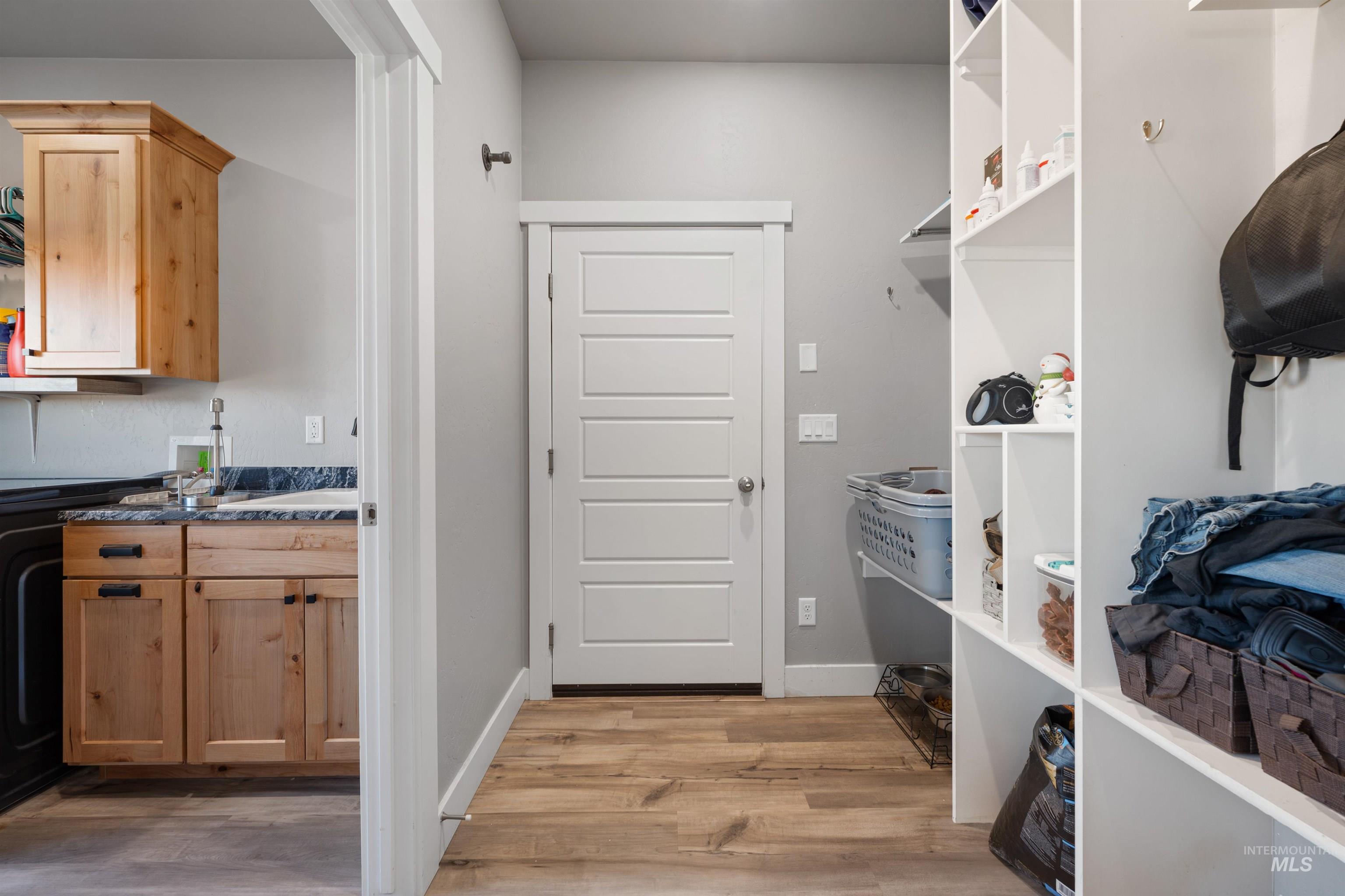 1005 Kenbrook Loop Twin Falls, ID 83301 - Photo 29 of 47 Laundry area featuring light wood-style floors, cabinet space, and washer / clothes dryer