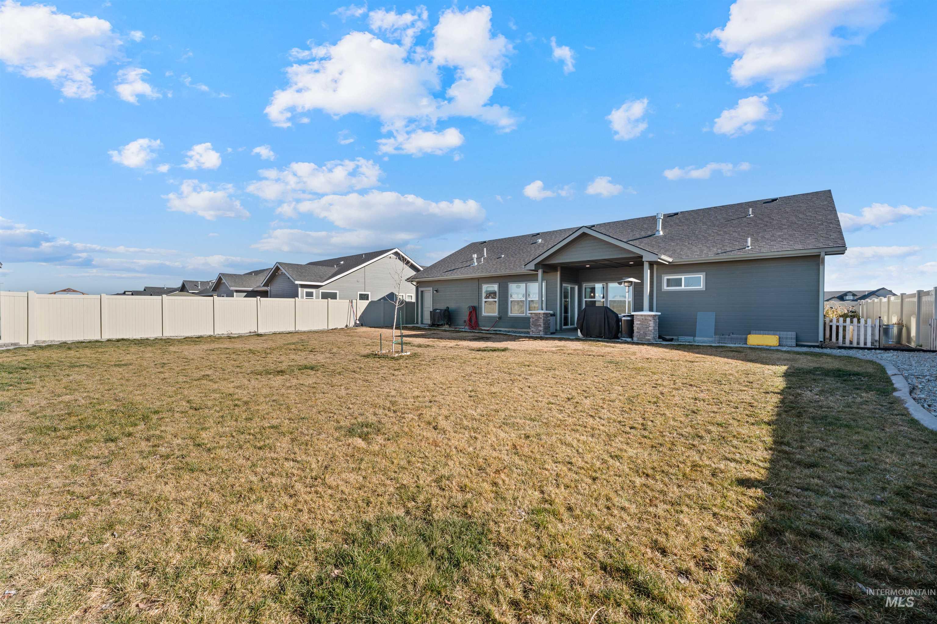 1005 Kenbrook Loop Twin Falls, ID 83301 - Photo 36 of 47 Rear view of property featuring a fenced backyard and a patio area