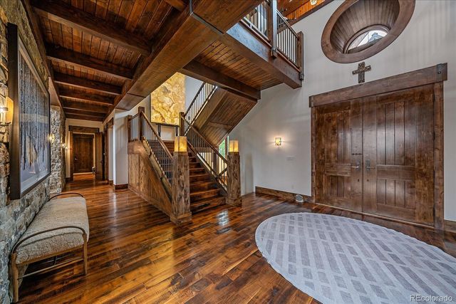 a bedroom with a bed couch and a window