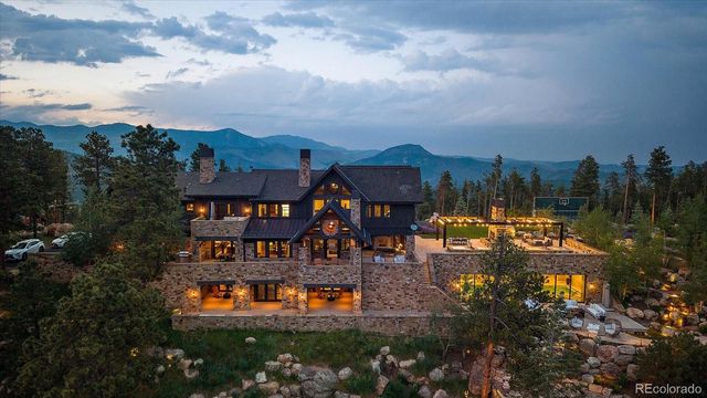 an aerial view of a house with a big yard