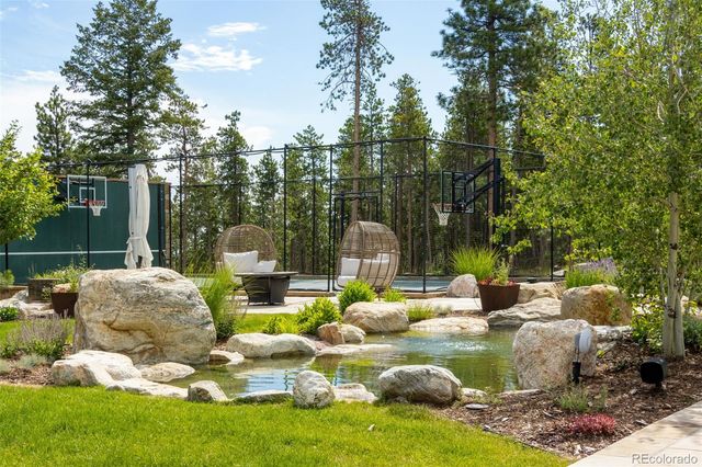 a dining area with stainless steel appliances kitchen island granite countertop a table and chairs