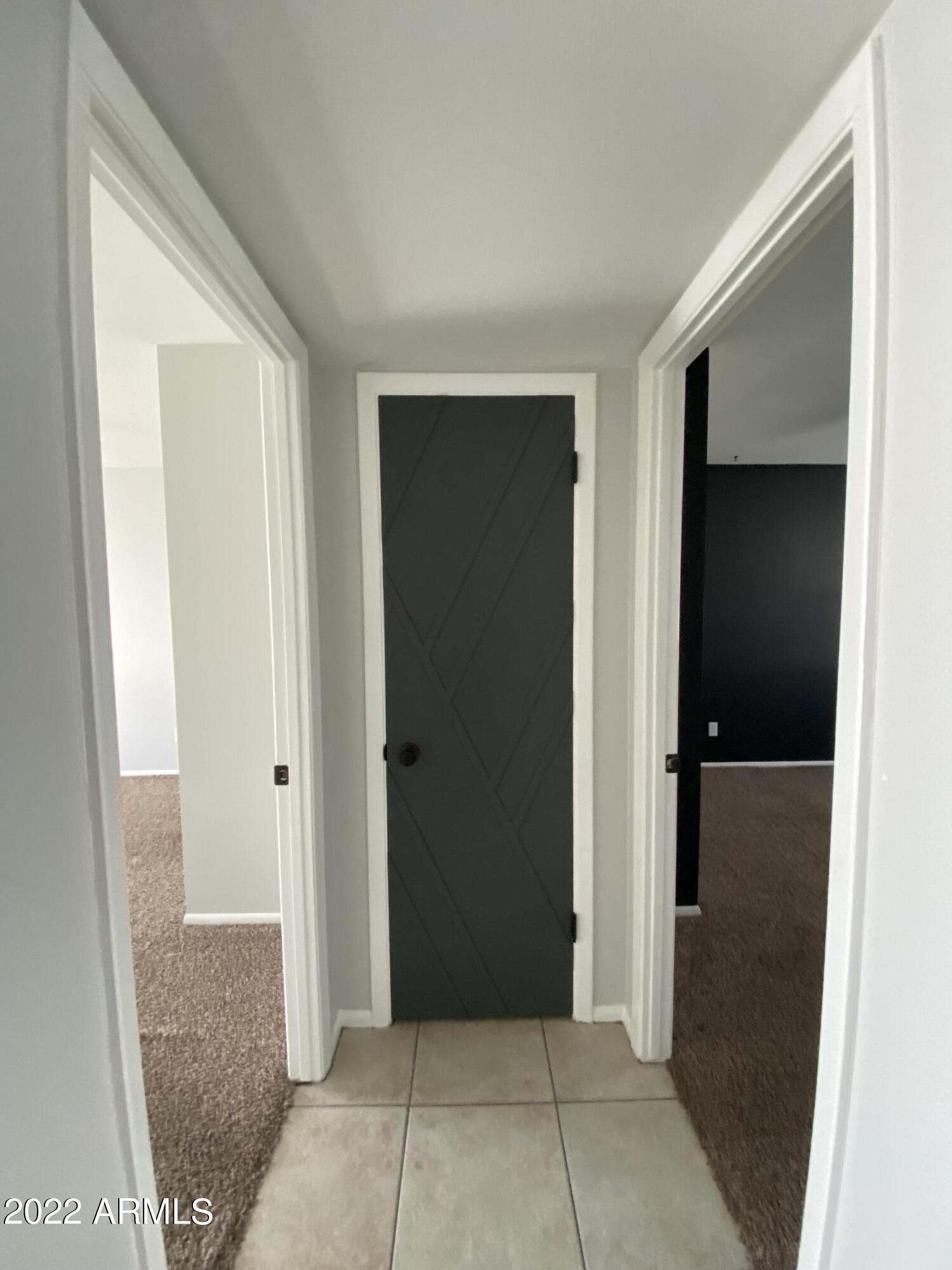 3244 West Yucca Street Phoenix, AZ 85029 - Photo 14 of 21 a view of a hallway with some storage area