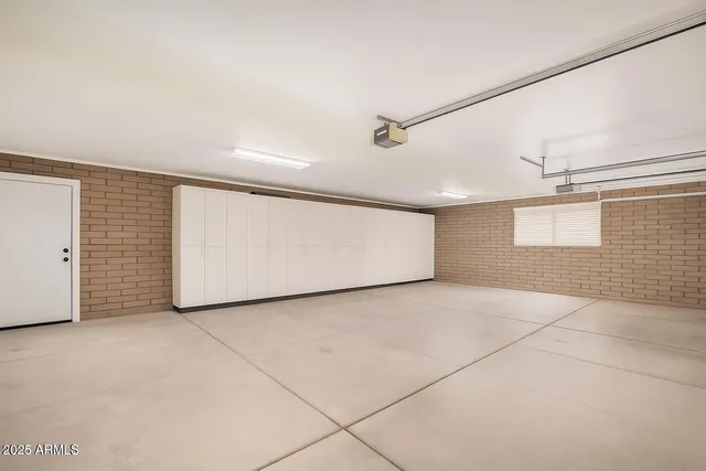 a view of white house with a yard