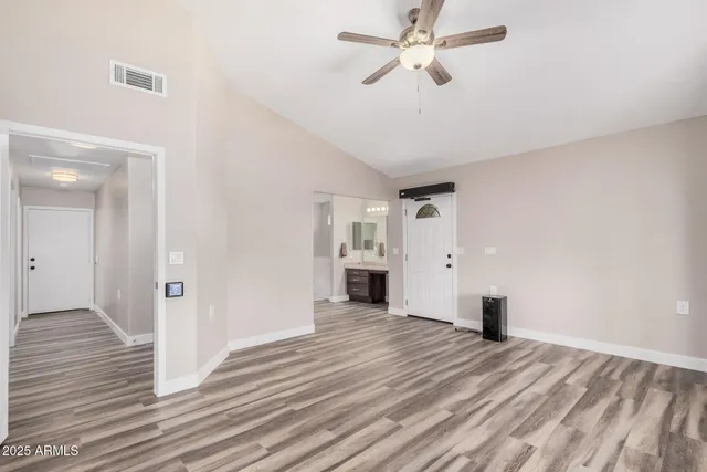 a bathroom with a double vanity sink a mirror and a shower