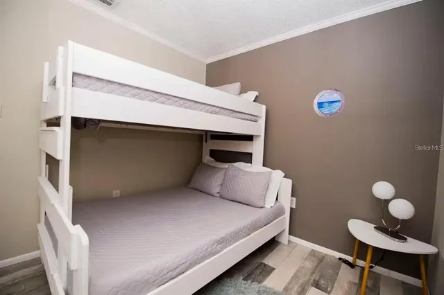 a bedroom with a bed and a table