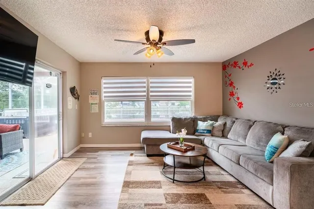 a living room with furniture and a large window