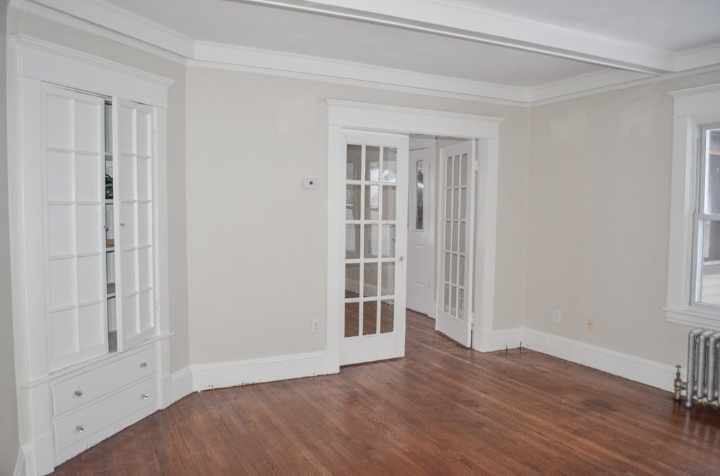 25 Eton Street Springfield, MA 01108 - Photo 14 of 31 a view of an empty room with wooden floor and closet