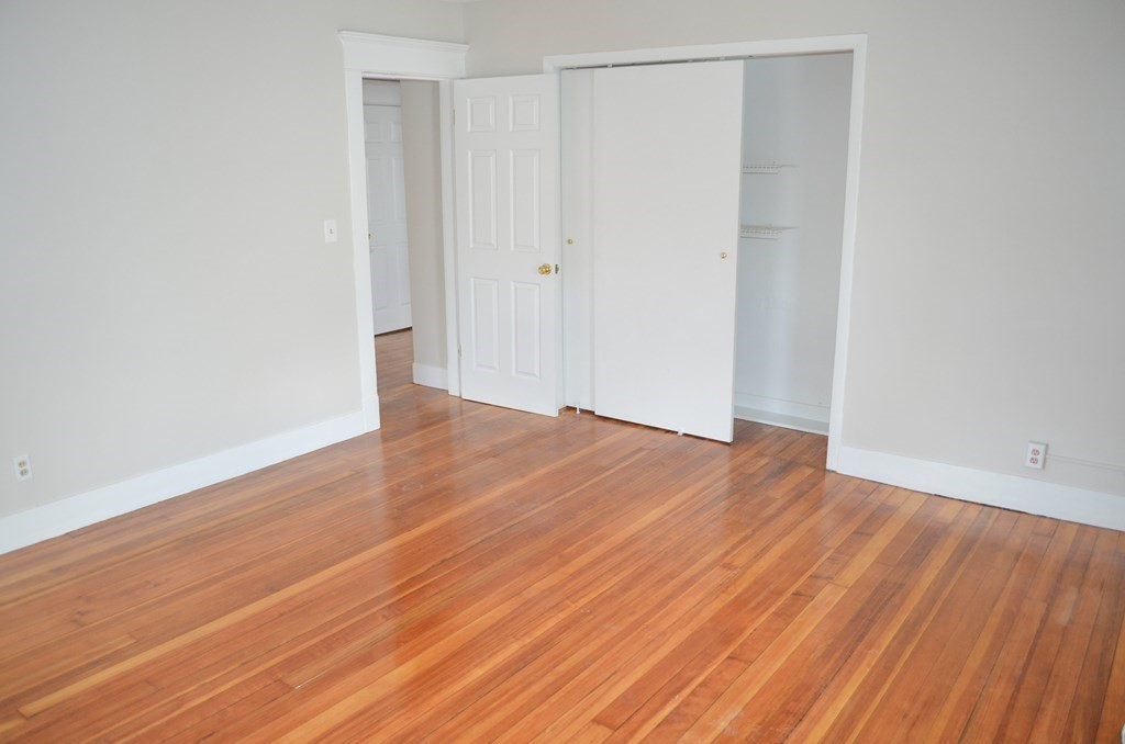 25 Eton Street Springfield, MA 01108 - Photo 19 of 31 a view of empty room with wooden floor