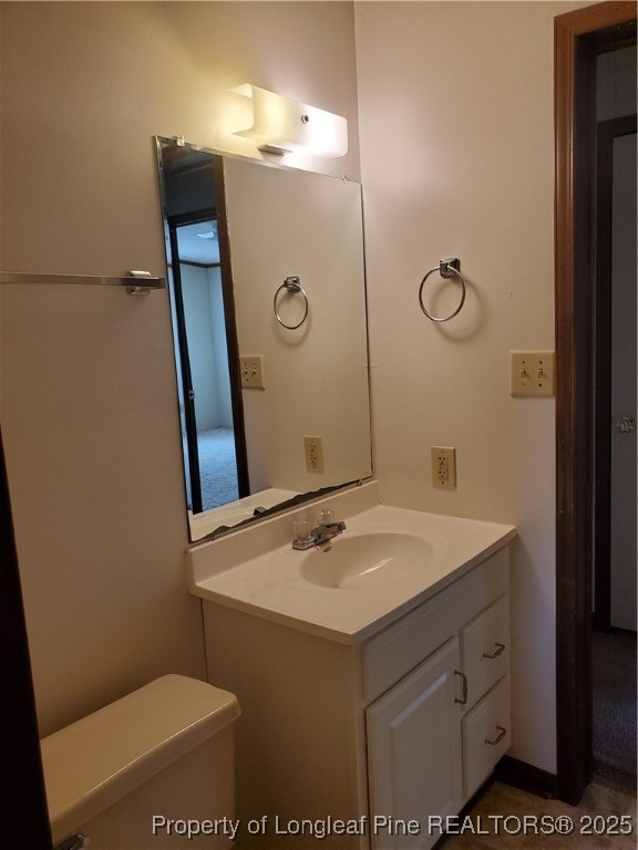 50 Old Forte Trail Spring Lake, NC 28390 - Photo 19 of 20 a bathroom with a sink a toilet and mirror
