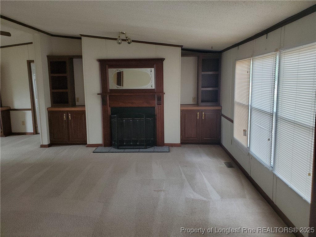 50 Old Forte Trail Spring Lake, NC 28390 - Photo 2 of 20 a view of an empty room with a fireplace