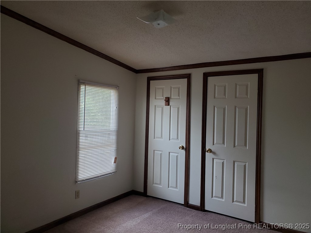 50 Old Forte Trail Spring Lake, NC 28390 - Photo 4 of 20 an empty room with windows