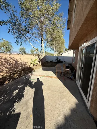 a view of a backyard of the house