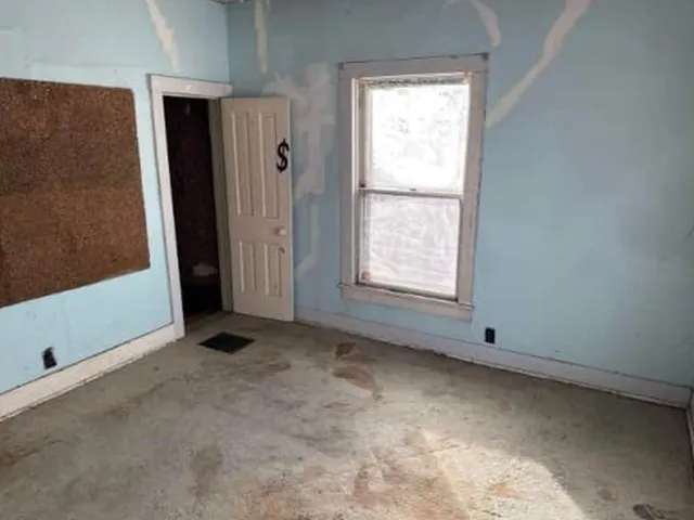 an empty room with windows