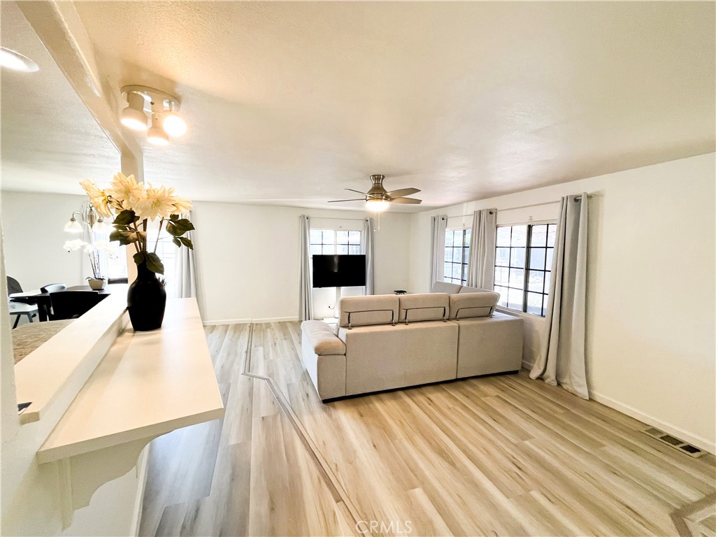 17700 Avalon Boulevard, Unit 40 Carson, CA 90746 - Photo 12 of 32 a living room with furniture and a flat screen tv