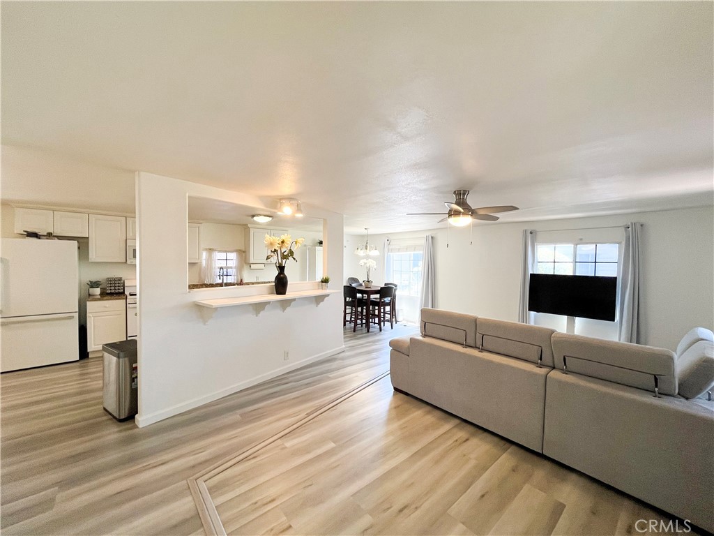 17700 Avalon Boulevard, Unit 40 Carson, CA 90746 - Photo 13 of 32 a living room with furniture and a flat screen tv