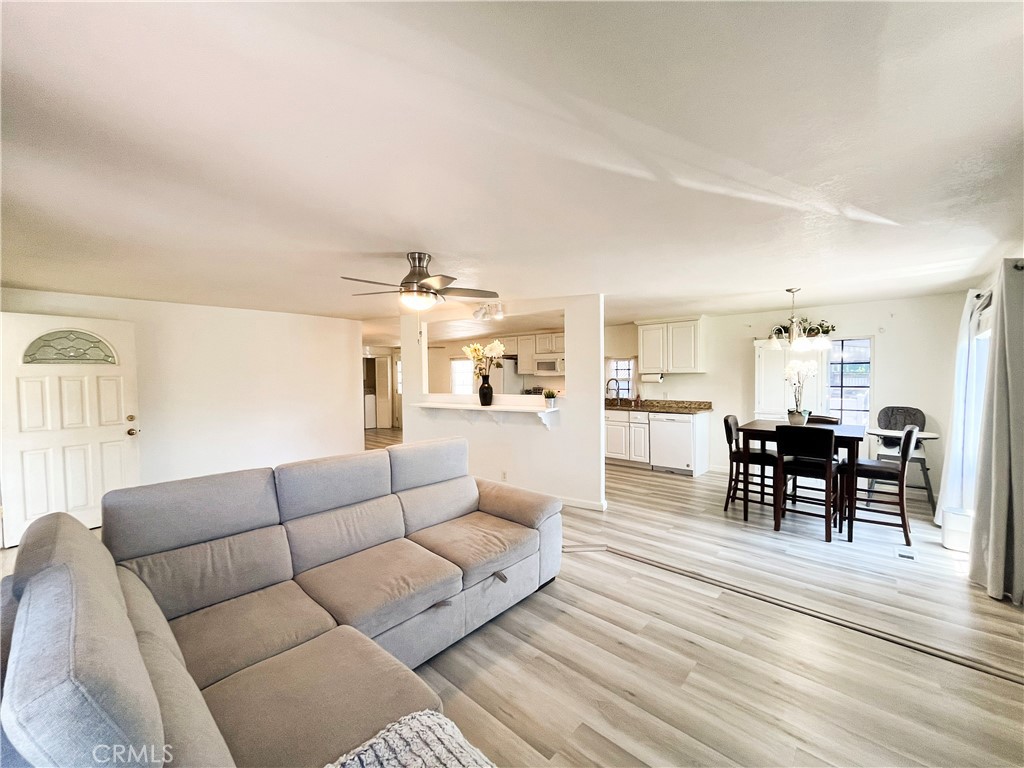 17700 Avalon Boulevard, Unit 40 Carson, CA 90746 - Photo 15 of 32 a living room with furniture wooden floor and kitchen view