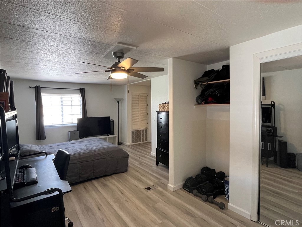 17700 Avalon Boulevard, Unit 40 Carson, CA 90746 - Photo 19 of 32 a bedroom with a bed and a large window