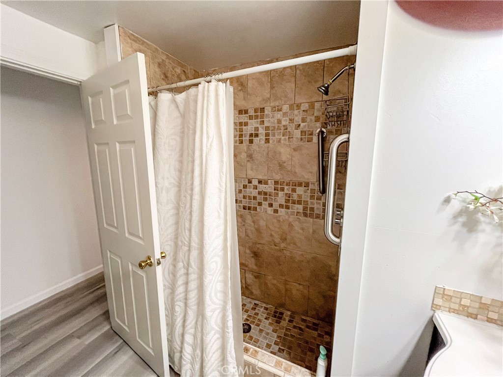 17700 Avalon Boulevard, Unit 40 Carson, CA 90746 - Photo 28 of 32 a bathroom with a shower and a curtain